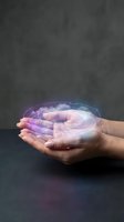 Hands holding glowing holographic sphere with purple and blue light effects against dark background, representing technology, innovation, and digital future concepts.