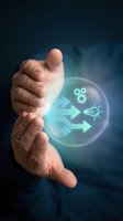 Businessman hands protecting glowing sphere with innovation process icons showing gears, lightbulb and arrows representing creative workflow and business development.