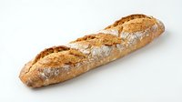 Fresh artisan baguette with golden crust and flour dusting isolated on white background for bakery marketing and culinary design projects.