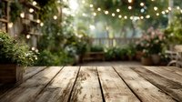 Rustic wooden table in cozy garden patio with string lights and lush greenery creating atmospheric outdoor dining space.