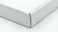 White cardboard box corner detail on clean background for packaging and shipping applications.