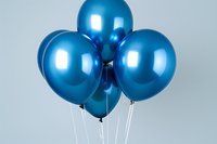 Elegant metallic blue balloons floating against light gray background, perfect for celebration designs, party invitations, and festive promotional materials.
