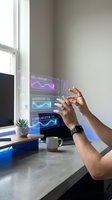 Man with dark skin tone interacting with holographic skill assessment display showing leadership and communication metrics in modern office workspace near window.