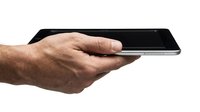 Male hand holding smartphone with black screen on white background, suitable for app promotion, technology marketing, and mobile device advertising.