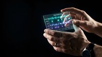 Hands holding transparent tablet displaying colorful audio waveform and sound frequency visualization against dark background for music production, sound engineering, and digital technology concepts.