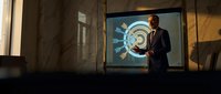 Professional businessman presenting financial growth data on large screen in modern conference room for corporate meetings and business strategy sessions.