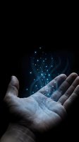 Open hands releasing glowing blue magical particles and light effects against dark background for fantasy and spiritual concepts.