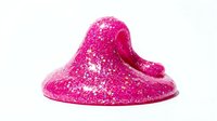 Bright magenta glitter slime with sparkly texture isolated on white background, ready for product photography, toy marketing, sensory play content, and children's craft designs.