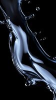 Dynamic liquid splash with water drops on black background creating abstract flowing shapes and curves with metallic silver reflective surface effect.
