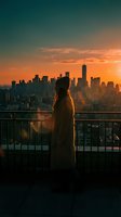 Woman standing on rooftop terrace overlooking illuminated metropolitan skyline at golden hour sunset. Urban lifestyle and travel concept for editorial and commercial use.