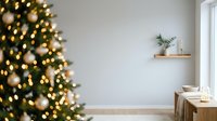 Decorated evergreen tree with warm golden lights in modern minimalist interior space with white walls, wooden furniture, and natural window light.