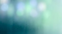 Soft blurred gradient background with blue and green tones, bokeh light effects creating dreamy atmosphere for presentations and design projects.