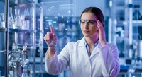 Female scientist in white lab coat touching holographic interface with data visualization in modern laboratory setting for technology research applications.