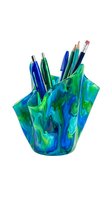 Vibrant blue and green marbled pencil holder filled with writing instruments, pens, and colored pencils isolated on white background for design use.