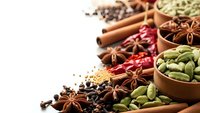 Aromatic spices and herbs collection with cinnamon sticks, star anise, cardamom pods, chili peppers in wooden bowls on white background for cooking.