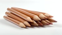 Wooden color pencils arranged in row on white background, natural art supplies for drawing and sketching. Isolated stationery objects for creative design.