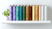 Row of colorful hardcover books arranged in rainbow order standing on white shelf with small green plant in white vase, modern minimalist home library decor.
