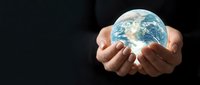 Two hands holding glowing Earth globe against dark background, symbolizing environmental protection, sustainability, and global responsibility for conservation and eco-friendly initiatives.