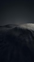 Dramatic monochrome landscape with rolling hills and moody dark sky creating atmospheric minimalist scenery for editorial and creative projects.