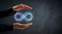 Businessman hands protecting glowing infinity symbol representing endless growth, sustainability, and continuous improvement for corporate business concepts.