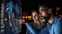 Middle-aged Caucasian male data scientist with beard and glasses analyzing digital dashboard with female colleague in modern office environment at night.