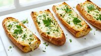 Baked potato skins filled with creamy cheese and fresh herbs on white plate, comfort food appetizer for restaurant menu and cooking blogs.
