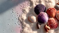 Colorful seashells and sand scattered on beach surface creating natural coastal decoration for summer vacation and marine themed designs.