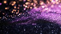 Magical purple and orange bokeh lights on dark background with glitter particles creating dreamy abstract festive atmosphere for holiday designs.