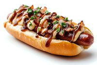 Grilled hot dog in fresh bun topped with caramelized onions, mustard and mayo drizzle, garnished with fresh herbs, served on white background for menu design.