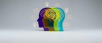 Colorful gradient human head silhouettes with glowing brain and lightbulb icons representing creativity, innovation and brainstorming concepts.