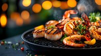 Grilled seafood platter with jumbo shrimp and scallops on cast iron pan, garnished with fresh herbs and lemon against blurred warm bokeh lights background.