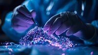 Scientist hands in purple gloves examining glowing particles on dark background with blue illumination, research of bioluminescent material in laboratory.