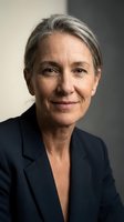Professional mature businesswoman with gray hair smiling confidently in dark suit jacket. Corporate executive portrait for leadership and success concepts.