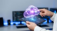 Professional holding tablet with glowing purple cloud computing hologram in modern office environment for digital transformation and data storage solutions.