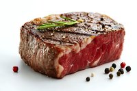 Juicy grilled beef steak with rosemary sprig, pink peppercorns and black pepper on white background, medium rare doneness showing marbled texture.
