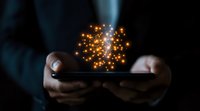 Hands holding smartphone with magical glowing particles emerging from screen in dark environment, creating mystical digital transformation effect.