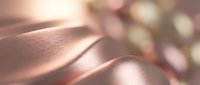 Close-up of soft fabric with warm sunlight creating gentle shadows and highlights, suitable for textile, fashion, and lifestyle design projects.