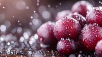 Fresh ripe cranberries with water drops and sparkling bokeh effect on dark background, macro food photography for winter holiday designs.
