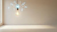 Light bulb with glowing innovation icons representing creative ideas, brainstorming and business solutions in modern minimalist interior space.