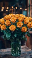 Bunch of golden orange roses in clear glass vase with green stems and leaves on wooden table, blurred urban bokeh background with warm lights for floral arrangements and home decor.