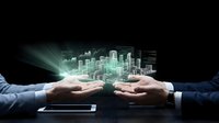 Businessman hands holding digital holographic city skyline projection above tablet on dark background, representing urban development, smart city technology, and business innovation.
