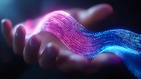 Glowing digital wave of particles flowing above open palm, transforming from pink to blue colors with luminous effect against dark background. Futuristic technology concept.