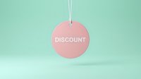 Pink circular discount tag hanging on mint green background, retail sale concept for promotions, shopping banners, and marketing designs.