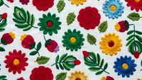 Colorful embroidered floral pattern with roses, daisies and leaves on white fabric background. Folk art style textile design for crafts and decoration.