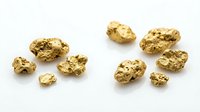 Gold nuggets collection isolated on white background for mining industry and precious metal investment concepts.