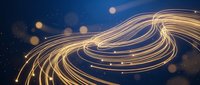 Abstract golden light trails flowing in elegant curves against deep blue background with bokeh effects for modern digital design projects.