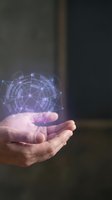 Hands holding glowing purple digital network hologram with connected nodes and data visualization for technology and innovation concepts.