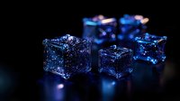 Glowing blue ice cubes with magical sparkle effect on dark background, frozen crystal blocks with ethereal luminescence create mystical atmosphere for beverage photography.