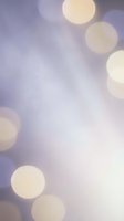 Soft purple bokeh lights background with warm golden circles creating dreamy atmosphere for romantic designs and elegant presentations.