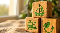 Wooden eco-friendly blocks with green sustainability symbols including recycling, leaf and nature icons on natural jute surface for environmental awareness.